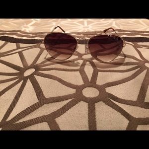Gold rimmed aviator sunglasses